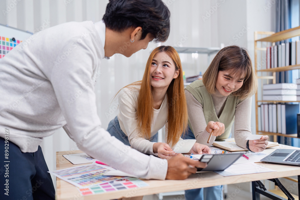 Wall mural creative team collaborating on ux ui design project in modern office environment