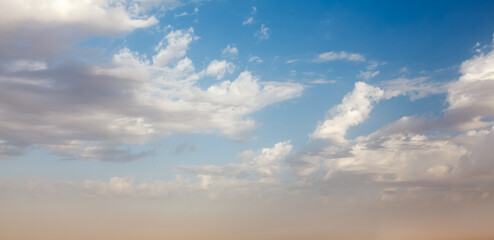 Peaceful and serene sky with clouds on sunset background