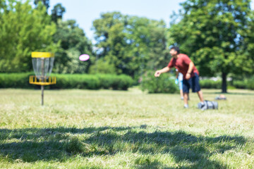 Man playing flying disc golf sport game