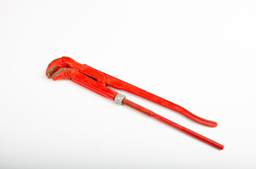 Old red pipe wrench  plumber tool  isolated on white background