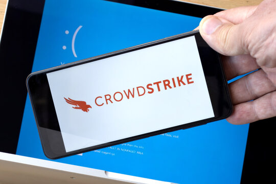 The CrowdStrike logo and a blue computer screen appeared during mass tech outages worldwide, causing IT systems to shut down. The Microsoft system error was caused by CrowdStrike.