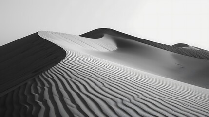 Desert sand dunes, with undulating patterns and shifting shadows.