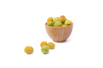 Fresh Ripe Plum Fruits in wooden bowl and outside isolated on white background with clipping path closed up.