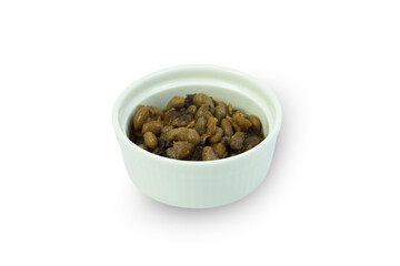 Salted or fermented soybean with mushroom paste or Taucheo in white bowl isolated on white background with clipping path closed up. Steamed, fermented with salt and wheat. A strong aromatic sauce.