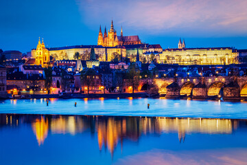 Travel Prague Europe concept background - view of Charles Bridge and Prague Castle in twilight. Prague, Czech Republic