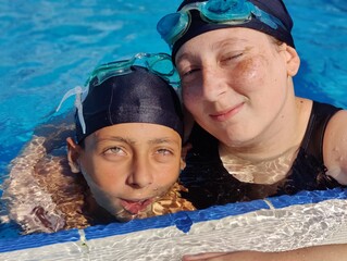 Joyful Youth in the Pool: Embracing Life's Simple Pleasures with a Splash of Happiness. Children swimming in the ness in the pool. 