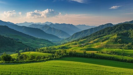 Obraz premium Pictures of vast green fields, rolling hills and small villages. located on a hill Behind are undulating mountains. The sky was a pinkish orange from the evening sun. This image showcases the beauty o