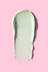 cream texture care cosmetics smear mask peeling green color on pink background skin care concept