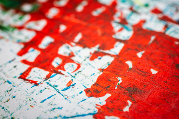 Extreme close up of colorful acrylic paint texture showing brush strokes. Selective focus.