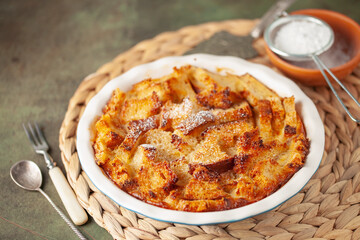 Homemade easy sweet dessert. Bread pudding in baking pan