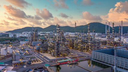 Aerial view petrochemical storage tank and oil refinery industry factory plant at night, Oil refinery and petrochemical plant industrial, Oil refinery and gas factory global business power and energy.