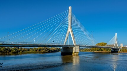 Naklejka premium A cable-stayed bridge with modern architectural design, spanning a bustling river
