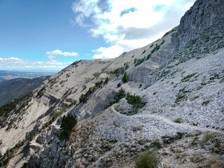 Mont Ventoux in Southern France. Blue Skies, white rocks, and barren top of the mountain. Beautiful views. 