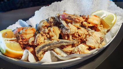 Delicious Mixed Seafood Fritters with Lemon Slices - High-Resolution Image