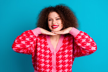 Photo of shiny attractive lady dressed red cardigan smiling arms chin empty space isolated blue color background