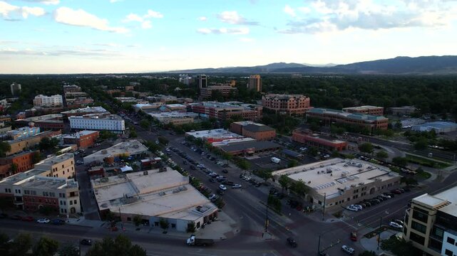 Aerial Drone orbit of downtown Fort Collins in Northern Colorado at sunset on a summer evening.