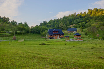 landscape with different traditional houses from Maramures, Romania, Houses built predominantly from wood.