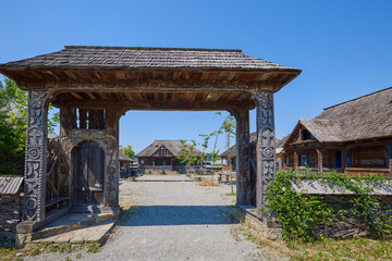 landscape with different traditional houses from Maramures, Romania, Houses built predominantly from wood.