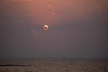 The setting sun at Murud beach. Murud is located 60 kms south of Alibag on the west coast of India.