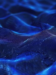 A close-up view of a piece of blue fabric with texture and weave visible