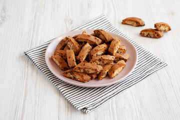 Homemade Cantuccini Cookies with Chocolate Chips on a Plate, side view.