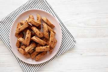 Homemade Cantuccini Cookies with Chocolate Chips on a Plate, top view. Copy space.