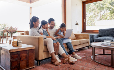 Obraz premium Laptop, smile and streaming with family laughing on sofa in home living room together for bonding or entertainment. Computer, funny movie or subscription service with mom, dad and kids in apartment