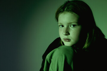 Portrait of a 10 year old girl. A serious portrait of a teenager, a vivid portrait of a growing teenager