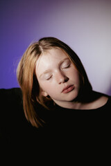 Portrait of a 10 year old girl. A serious portrait of a teenager, a vivid portrait of a growing teenager