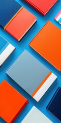 A set of colorful, hardcover notebook covers arranged in an overhead view on a blue background. The cover designs feature minimalist designs