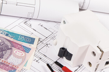 Electrical components using in electric installations, construction diagrams, work tools and polish currency banknotes. Planning build or buy house