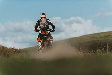 Obraz premium Professional enduro bike rider on action. Motocross sport.
