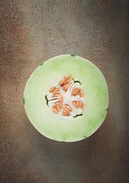 Dino melon, cut, on the table, top view, no people,