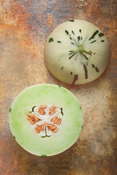 Dino melon, cut, on the table, top view, no people,