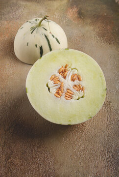 Dino melon, cut, on the table, top view, no people,