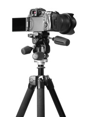 Modern camera with tripod isolated on white. Photographer's equipment