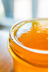 Honey Jar with Glossy Bee Honey Filled to the Brim