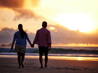 Sunset, beach and couple with love, holding hands and romance with tropical island, vacation and honeymoon. Seaside, golden hour and man with woman, relationship and holiday for anniversary or travel