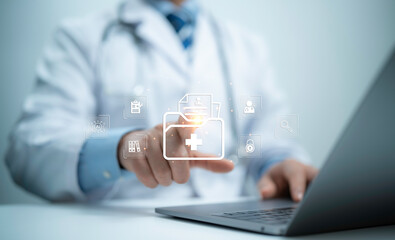 Medical professional efficiently managing document workflows. Utilizing a comprehensive document management system on laptop computer to search, organize, and handle files online document database.