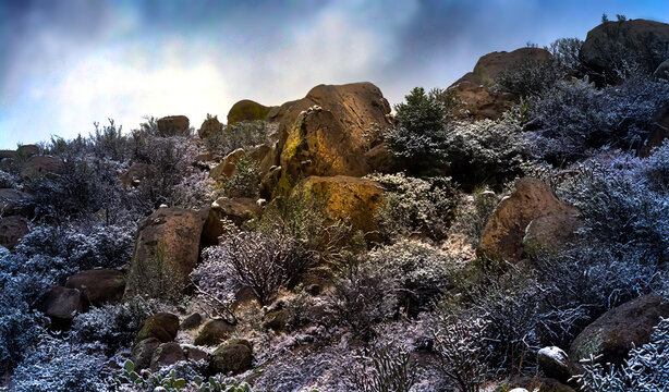 Rocky desert landscape with a dusting of snow