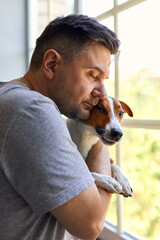 Adorable man and lovable pretty Jack Russel terrier