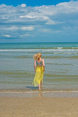 Natural woman's beauty concept. Lady at the beach in romantic feminine style