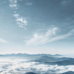 Obraz premium Tall mountain peaks high in the sky surrounded by clouds
