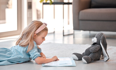 Obraz premium Reading, book and child in lounge, learning and teddybear for girl on floor with story of literature. Student, growth nd development for kid, knowledge and youth with textbook of elementary in home