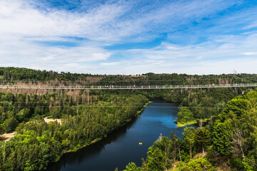 Titan RT rope suspension bridge over the Rappbodetalsperre in the Harz Mountains in Germany.