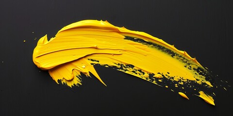 one stroke of yellow paint on black isolated background