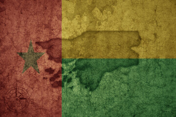 map and flag of guinea bissau on a old vintage crack paper background .
