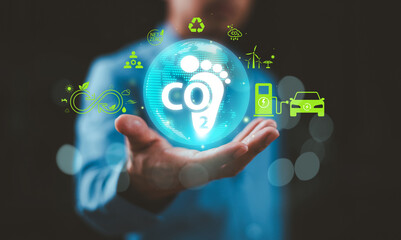 Fototapeta premium Carbon footprint icon. Reduce CO2 emission to limit global warming and climate change concept. Sustainable development, green business on renewable energy, electric transport. Foot print reduction