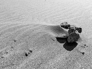 Stones and pebbles catching wind patterns on Sotavento Beach, Costa Calma, Fuerteventura, Spain