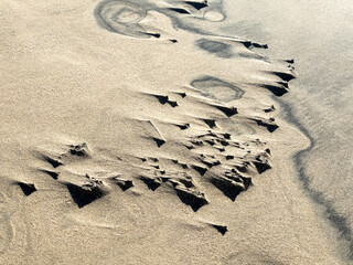 Stones and pebbles catching wind patterns on Sotavento Beach, Costa Calma, Fuerteventura, Spain